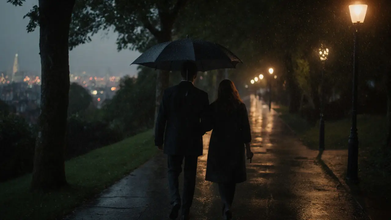 Two people walk side by side in the rain through Primrose Hill, sharing quiet companionship.